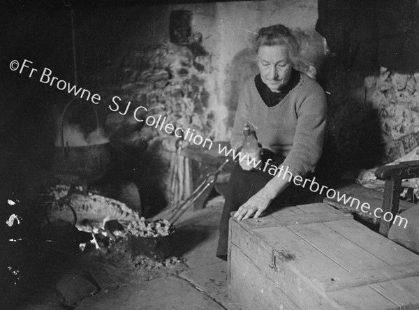 COTTAGE INTERIOR LADY WITH CHEST